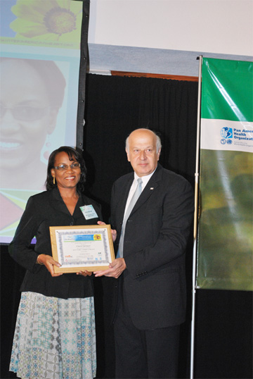 In photo: Cheryl Springer (left), who was the first Caribbean winner, receives her award from Dr Rafael Shuchleib, IAHF President.