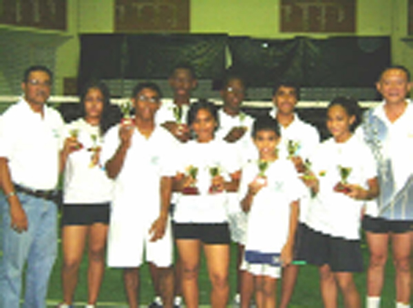 President of the Guyana Badminton Association Gokarn Ramdhani with the winners of the various categories along with a representative from the Consulate of the People’s Republic of China at right. 