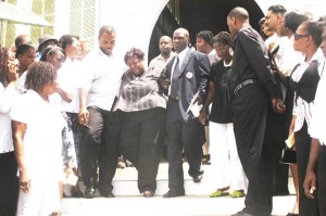 Unbearable grief:  Sandra Austin, mother of NCN reporter, Akila Jacobs weeping as she leaves St George’s Cathedral yesterday. (Photo by Aubrey Crawford)