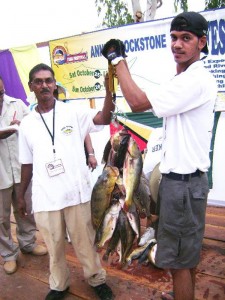 The Sugrims weighing their largest catch. 