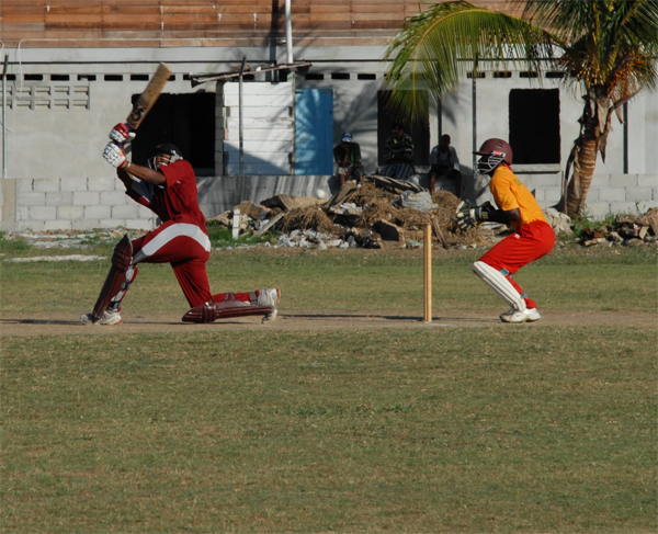 Tournament MVP Christopher Barnwell goes down on his knees to get a delivery out of the way in the final of the Malteenoes Sports Club/ Carib Beer Sixes against Rose Hall Town Windies Sports Bar on Tuesday. (Clairmonte Marcus photograph)   