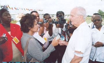 Stabroek News Editor in Chief and Chairman of the Board of Directors David de Caires (right) being interviewed during a protest outside the Caricom Secretariat in October  2007, against the withdrawal of government advertisements from this newspaper. (Stabroek News file photo)
