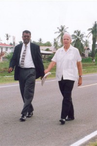 Stabroek News Editor in Chief and Chairman of the Board of Directors David de Caires (right) walks with AFC leader Khemraj Ramjattan during a protest outside the Caricom Secretariat in October  2007, against the withdrawal of government advertisements from this newspaper. (Stabroek News file photo) 