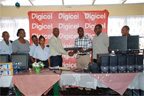 Digicel Network Manager Ryan Sinclair (third from right) presents five computer systems to Director of Prisons Dale Erskine 