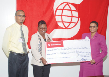 Scotiabank recently donated $600,000 to the Ministry of Labour, Human Services and Social Security for the care of orphans and vulnerable children affected by HIV. In a press release the Bank said the donation was in keeping with its mandate under its Bright Future Programme, a new international corporate giving venture being  conducted across the Caribbean and in Latin America. The programme aligns Scotiabank’s community-based initiatives towards a single goal – providing opportunities for children in communities in which it operates and where its customers and employees reside.  In picture: the Bank’s representatives Abu Zaman, left and Karen Gittens, right,  present the cheque to Ann Greene, Director of Children’s Services at the ministry.  