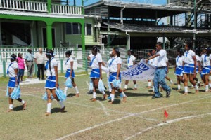  The Butler House team gives an eyes-right salute to executive members of the St. Stanislaus School’s Board yesterday during the march past of their annual Inter-house Championships at the GCC Ground, Bourda yesterday. (Clairmonte Marcus photo) 