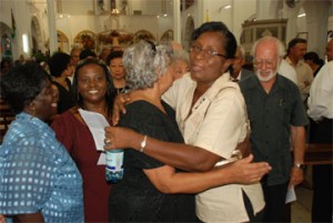 Doreen de Caires, widow of Stabroek News Editor-in-Chief David de Caires being embraced by member of staff Mary Evelyn.    