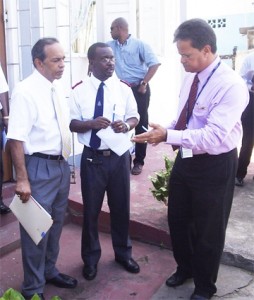PSC Chairman Gerry Gouveia (right) makes a point to Chairman of the Board of the Salvation Army Edward Boyer (left) and Divisional Commander of the Salvation Army Major Sinous Theodore.