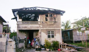 The Martins’ home after the fire.  