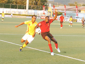Guyana’s Collie Hercules, left, is battling to save Guyana’s football.  