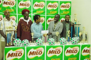 Nestle’s Marketing Representative Ramdat Rampersaud (3rd L) presents the 2008 Milo U-21 sponsorship cheque to GFA’s Secretary Marlan Cole (2nd R) while GFA President, Organizing Secretary and PRO Troy Mendonca (R), Lester Sealey and Sampson Gilbert (2nd L) look on. (Clairmonte Marcus photo)	 