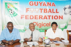 IN FOR THE LONG HAUL! Guyana Football Federation (GFF) president Colin Klass, centre flanked by GFF general secretary Noel Adonis and Aubrey `Shanghai’ Major left at yesterday’s press conference. (Clairmonte Marcus photo)    