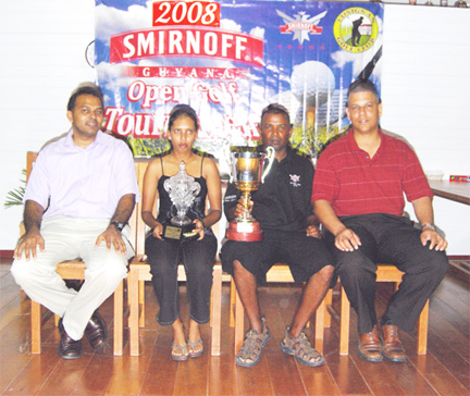 Winners of the Guyana Open squash tournament Christine Sukhram, second left and Imran Khan, second right, pose with Minister of Culture, Youth and Sports Dr. Frank Anthony and Banks DIH representative Carlton Joao following the conclusion of the two-day tournament yesterdat at the Lusignan Golf Club course. (Lawrence Fanfair photo)