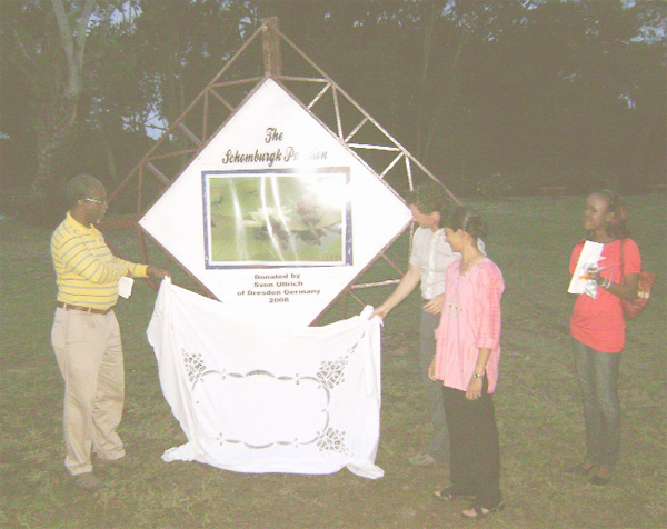 Chairman of the National Parks Commission (NPC), John Caesar (left) along with funder of the project, German national, Sven Ullrich unveil the ‘Schomburgk Pavilion’ sign at the Botanical Gardens yesterday as General Manager of the NPC, Yolanda Vasconcellos (second from right) and NPC’s Janelle Lee look on. 