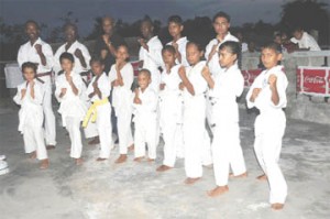 Students of the newly-formed Tuschen dojo show their readiness to help move the sport forward. (Clairmonte Marcus photo)      