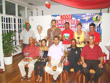 Prize winners pose with Minister of Culture, Youth and Sport Dr. Frank Anthony (centre) Guyana Open men’s champion, Imran Khan, (second right, front row), Christine Sukhram,  ladies’ winner  (second left),  Jerome Khan (extreme left) and Banks DIH Sales Executive Carlton Joao ( extreme right). Standing back row: President of Lusignan Golf Club, Mel Sankies, Rita Heikens, Andre Cummings, Munaf Arjune, Petra Beems and Colin Ming.  
