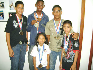  The Guyana Junior badminton team with the spoils.   
