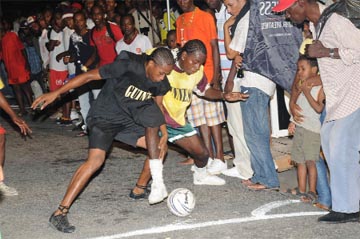 Action in the match between Tiger Bay and Leopold Street. (Clairmonte Marcus photo)    