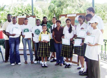 The awardees display their certificates.