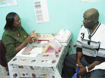 TB Outreach Supervisor, Faye Jones advises a patient during a session at the Chest Clinic, Georgetown Public Hospital.  