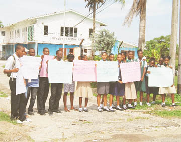 It’s not fair! Athletes from Districts 11, 12, 13, 14 and 5 protesting outside of the Guyana Teachers Union (GTU) yesterday. (Lawrence Fanfare Photo) 