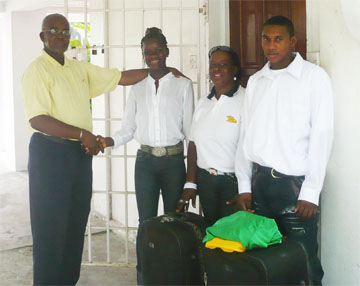 AAG President Claude Blackmore (left) wishes the Guyanese team the best before they depart for Lima, Peru for the South American Youth Championships. From right is Ricardo Martin, team manager Pamela Philips and Janella Jonas.  