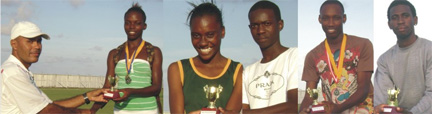 Beacon Ministries Pastor Anthony Alphonso (at left) presents the under-16 individual champion Malika Cordis with her trophy. From right is Cleveland Thomas, Patrick King, Jamal Holland and Ianna Graham. 