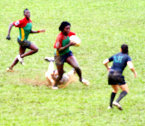 A Guyana Allstar player,outruns a USA Atlantis defender on her way to scoring  one of five tries in their 29-5 victory in Trinidad over the weekend.