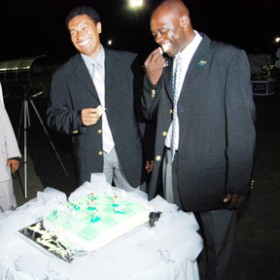 Happy Anniversary!!! A happy night it was as Director and Co-director of the K&S organization Aubrey ‘Shanghai’ Major (right) and Kashif Mohammed (left) share the moment of sticking the cake at their tournament’s 19th anniversary. (Lawrence Fanfair photo) 