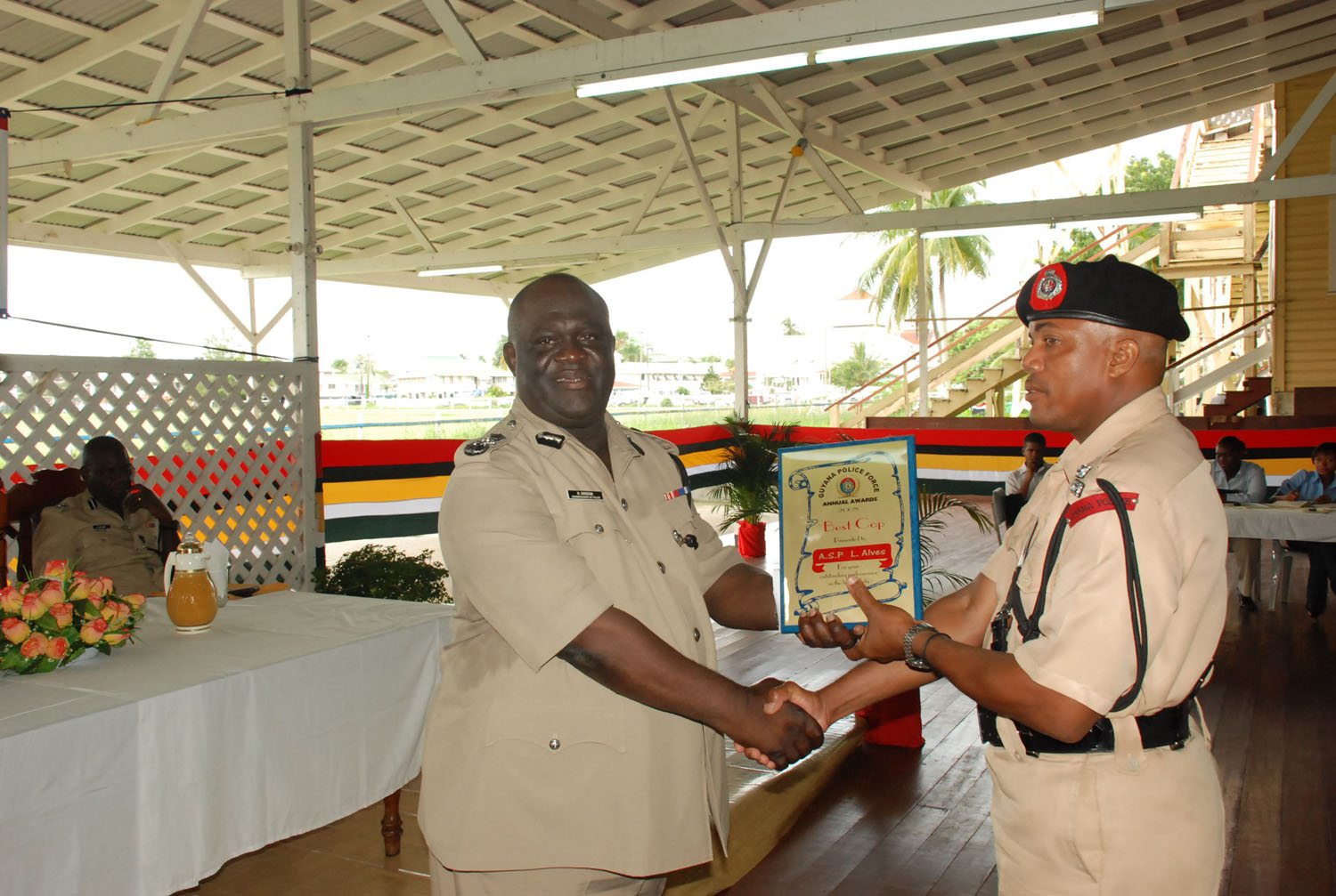 Outstanding performance: This year’s Best Cop Assistant Superintendent Lyndon Alves (right) collects his award from Acting Police Commissioner Henry Greene. (Jules Gibson photo) 