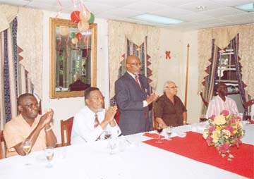 Lt Colonel (ret’d) Gregory Gaskin (standing) makes a point. He is flanked by, from left, seated, Lt Colonel (ret’d) Randy Storm and Prime Minister Samuel Hinds and from right Security Manager at John Fernandes Ltd Cecil Kilkenny and Dougal Kirkpatrick of Professional Guard Service.