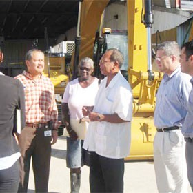 City Hall officials receiving the loaned MACORP excavator