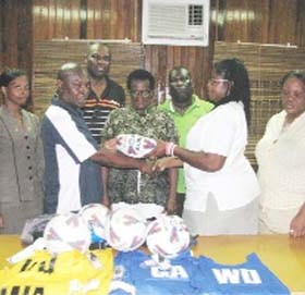 Guyana Netball Association’s (GNA) Maxine Parris (second right) receives a ball from RPSF Liaison officer Troy Peters (second left). Also in photo are Shondell Samaroo, Lawrence “Sparrow” Griffith, Jeanette Lovell, Brian King and Donna Boston.       