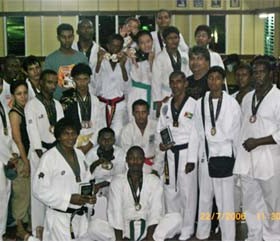 Participants of the fourth Guyana Taekwondo Association’s Dando Cup display their medals at the conclusion of the competition.  