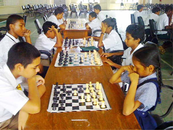  Alexander Brassington is a model of concentration as he faces Sheriffa Ali of the Winfer Gardens Primary School. Sheriffa is active on the local tournament circuit and was the only primary school student who participated in the National Schools’ Chess Championship. She played in Category A of the competition and placed sixth.