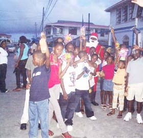 Some of the children who attended the Vreed-en-Hoop Police Station’s Christmas party pose with Santa Claus.  