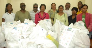 On December 19, the volunteer group, Friends of the Needy handed over 100 hampers as Christmas gifts to various disabled persons’ organizations. A press release from the National Commission on Disability (NCD) says the handing over was done by Indra Chandarpal on behalf of Friends of the Needy. The NCD said that persons with  disabilities are among the most disadvantaged in Guyana and there are a number of organizations working hard to reverse this. NCD Office Administrator Beverly Pile thanked Friends of the Needy for its donation. The organizations that received hampers were United Action for Differently Abled Persons, Guyana Society for the Blind, Support Group for Deaf Persons, Guyana Association for the Visually Impaired, Young Voices Guyana and Ruimveldt Parent Support Group among others. In photo, Indra Chandarpal (fourth from left) stands with some of the recipients.