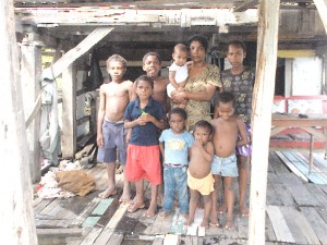 Narinedai Narine surrounded by her seven children in their Bareroot home.   