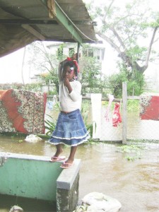 On higher ground: This little girl at Dochfour stood on her front patio looking out yesterday.
