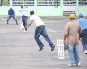 Part of the action in the Dyna’s embroidery/Carib Super 7 tape ball competition at the National Park tarmac yesterday. (A Calvin Roberts photograph) 