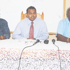 From left to right: Director of Sports, Neil Kumar, Minister of Culture, Youth and Sports, Dr. Frank Anthony and Permanent Secretary Keith Booker at the head table. (A Lawrence Fanfair photograph). 