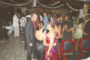 President Bharrat Jagdeo (left, foreground) chats with three guests at the Old Year’s Night Ball at the GDF Officers Mess, Camp Ayanganna, Thomas Lands on Wednesday night. (Photo by Lawrence Fanfair)  