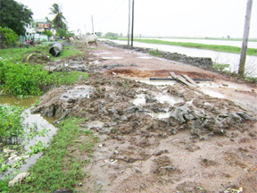 The tube that is visible in the left background of this photo was supposed to be installed in the dug-out area across the Dochfour Access Road to aid in draining the water. 