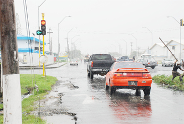 The broken edges of Hunter Street near the traffic light at the junction with Mandela Avenue.