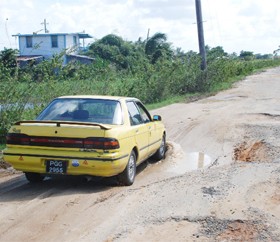 This vehicle in one of the huge potholes on the Cummings Lodge road.