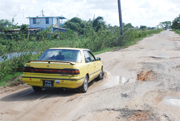 This vehicle in one of the huge potholes on the Cummings Lodge road.