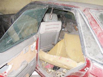 The stripped and  damaged Nissan  in the Brickdam Police Station compound. 