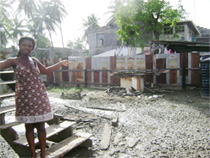 Adella points to the watery mud in her Ann’s Grove yard yesterday. 