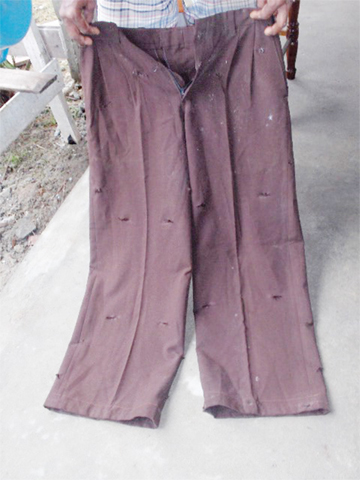 Bullet-riddled pants that belonged to Shazam Mohamed.
