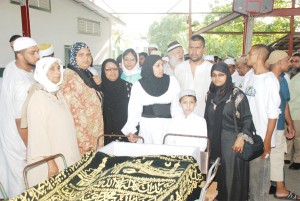 Members of Ayube Hamid’s family at yesterday’s last rites. 